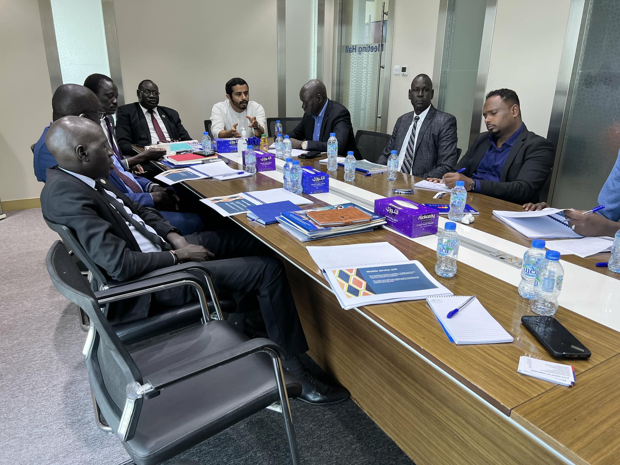 Participants gathered around a conference table for discussion.
